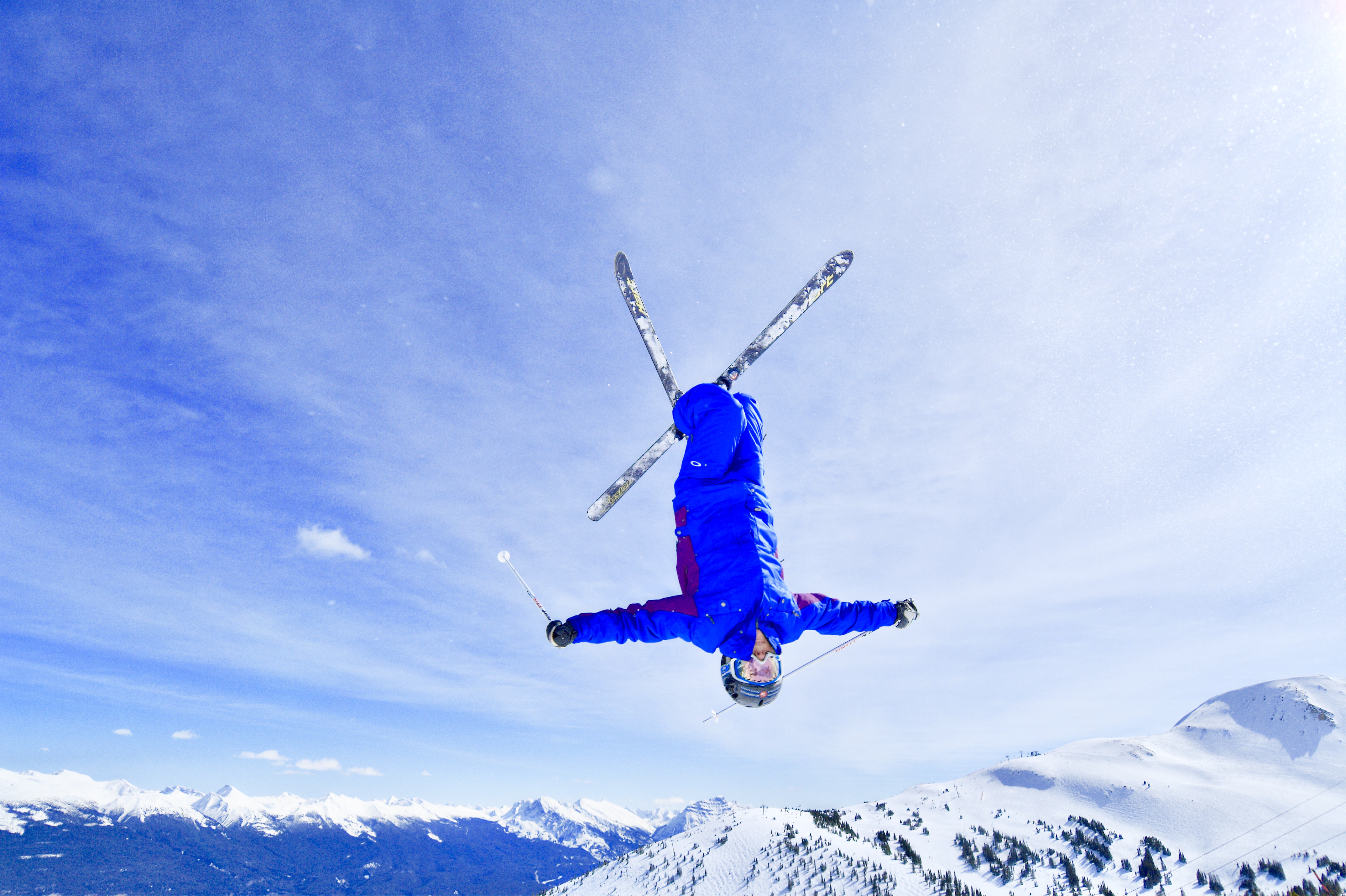 Our founder mid-air on skis — the relentless training translated into a plan that actually fits a real life.